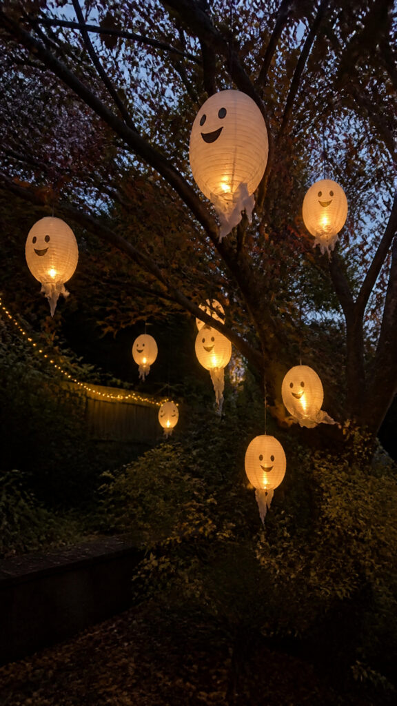 Glowing Ghost Lanterns in Trees