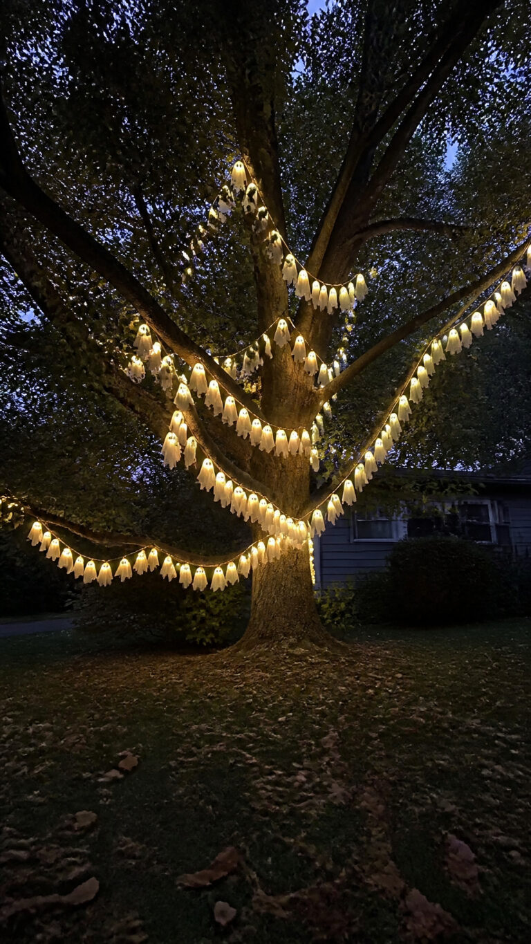 Glowing Ghost Garlands Wrapped Around Branches